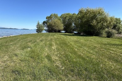 Enjoy breathtaking views of Flathead Lake and the iconic Mission on Polson Bay Golf Course - Championship Course in Montana - for sale on GolfHomes.com, golf home, golf lot