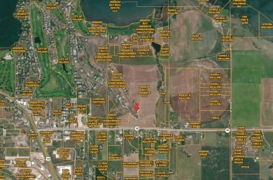 Enjoy breathtaking views of Flathead Lake and the iconic Mission on Polson Bay Golf Course - Championship Course in Montana - for sale on GolfHomes.com, golf home, golf lot