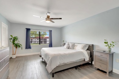 Experience breathtaking lakefront living in this stunning on Boca Lago Golf and Country Club in Florida - for sale on GolfHomes.com, golf home, golf lot