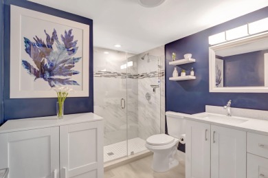 Experience breathtaking lakefront living in this stunning on Boca Lago Golf and Country Club in Florida - for sale on GolfHomes.com, golf home, golf lot