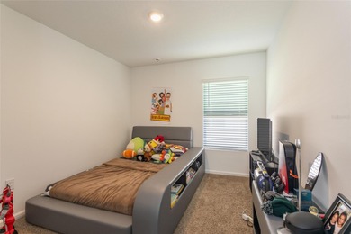 Welcome to this charming 4-bedroom, 2-bathroom home, built in on Grand Reserve Golf Course in Florida - for sale on GolfHomes.com, golf home, golf lot