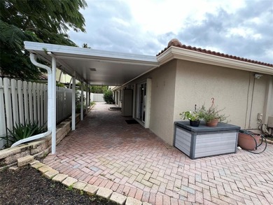 Wish you had a pool and a hot tub? Look no more! WELCOME to this on Palm-Aire Country Club and Resort - The Oaks in Florida - for sale on GolfHomes.com, golf home, golf lot