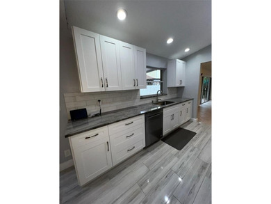 Wish you had a pool and a hot tub? Look no more! WELCOME to this on Palm-Aire Country Club and Resort - The Oaks in Florida - for sale on GolfHomes.com, golf home, golf lot