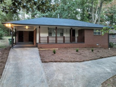 Welcome to your stunning and amazingly renovated home, nestled on Alfred Tup Holmes Golf Course in Georgia - for sale on GolfHomes.com, golf home, golf lot