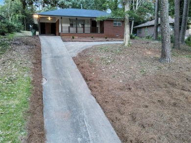 Welcome to your stunning and amazingly renovated home, nestled on Alfred Tup Holmes Golf Course in Georgia - for sale on GolfHomes.com, golf home, golf lot