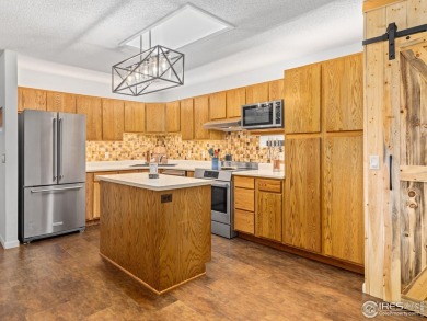 Easy living at Vista Lane! Drop off your groceries & hit the on Lake Estes Golf Course in Colorado - for sale on GolfHomes.com, golf home, golf lot
