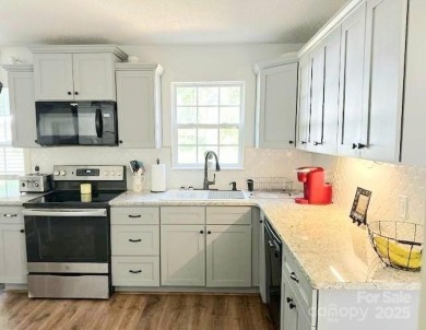 Charming 3-bedroom, 2-bath home in the heart of Denver, just 1 on Westport Golf Club in North Carolina - for sale on GolfHomes.com, golf home, golf lot