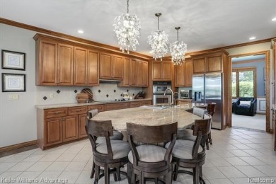 Welcome to 23790 Point O Woods Court - a stunning custom-built on River Bank Golf Course in Michigan - for sale on GolfHomes.com, golf home, golf lot