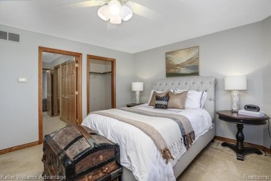 Welcome to 23790 Point O Woods Court - a stunning custom-built on River Bank Golf Course in Michigan - for sale on GolfHomes.com, golf home, golf lot
