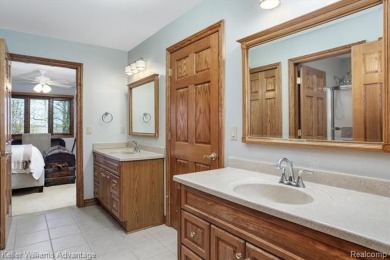 Welcome to 23790 Point O Woods Court - a stunning custom-built on River Bank Golf Course in Michigan - for sale on GolfHomes.com, golf home, golf lot