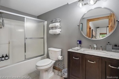 Welcome to 23790 Point O Woods Court - a stunning custom-built on River Bank Golf Course in Michigan - for sale on GolfHomes.com, golf home, golf lot