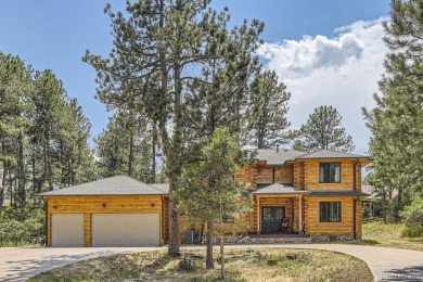 Nestled in the peaceful forest of Larkspur, CO, this mountain on The Golf Club At Bear Dance in Colorado - for sale on GolfHomes.com, golf home, golf lot