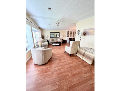 From the moment you walk through the door, you'll fall in love on Pine Lakes Country Club in Florida - for sale on GolfHomes.com, golf home, golf lot