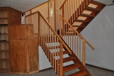A well-kept split level home with 2 bedrooms on the main floor on Cooperstown Country Club in North Dakota - for sale on GolfHomes.com, golf home, golf lot