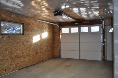 A well-kept split level home with 2 bedrooms on the main floor on Cooperstown Country Club in North Dakota - for sale on GolfHomes.com, golf home, golf lot