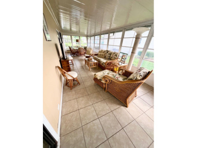 From the moment you walk through the door, you'll fall in love on Pine Lakes Country Club in Florida - for sale on GolfHomes.com, golf home, golf lot