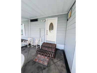 From the moment you walk through the door, you'll fall in love on Pine Lakes Country Club in Florida - for sale on GolfHomes.com, golf home, golf lot