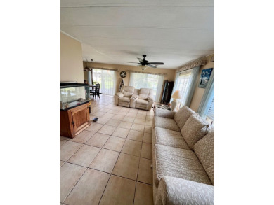 Welcome to this 2-bedroom, 2-bathroom home located in the gated on Pine Lakes Country Club in Florida - for sale on GolfHomes.com, golf home, golf lot