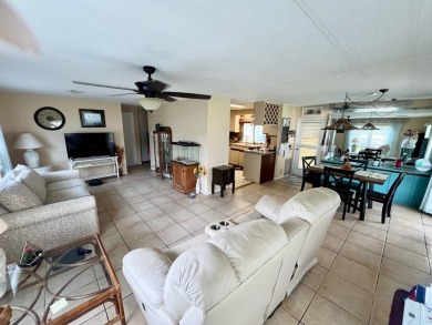 Welcome to this 2-bedroom, 2-bathroom home located in the gated on Pine Lakes Country Club in Florida - for sale on GolfHomes.com, golf home, golf lot