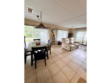 Welcome to this 2-bedroom, 2-bathroom home located in the gated on Pine Lakes Country Club in Florida - for sale on GolfHomes.com, golf home, golf lot