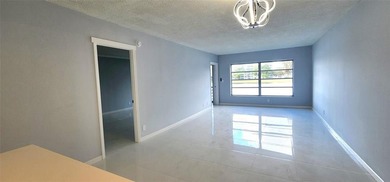 Spacious Remodel  Balcony/Sunroom enclosed for additional living on Palm-Aire Country Club and Resort - The Oaks in Florida - for sale on GolfHomes.com, golf home, golf lot