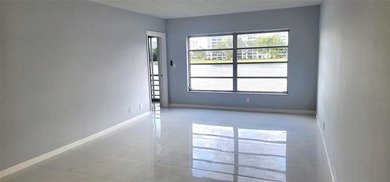 Spacious Remodel  Balcony/Sunroom enclosed for additional living on Palm-Aire Country Club and Resort - The Oaks in Florida - for sale on GolfHomes.com, golf home, golf lot