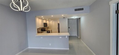 Spacious Remodel  Balcony/Sunroom enclosed for additional living on Palm-Aire Country Club and Resort - The Oaks in Florida - for sale on GolfHomes.com, golf home, golf lot