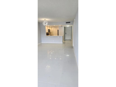 Spacious Remodel  Balcony/Sunroom enclosed for additional living on Palm-Aire Country Club and Resort - The Oaks in Florida - for sale on GolfHomes.com, golf home, golf lot