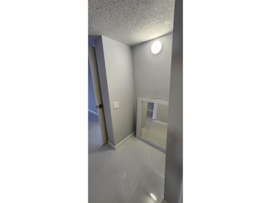 Spacious Remodel  Balcony/Sunroom enclosed for additional living on Palm-Aire Country Club and Resort - The Oaks in Florida - for sale on GolfHomes.com, golf home, golf lot