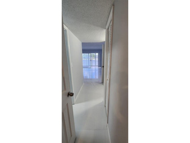 Spacious Remodel  Balcony/Sunroom enclosed for additional living on Palm-Aire Country Club and Resort - The Oaks in Florida - for sale on GolfHomes.com, golf home, golf lot