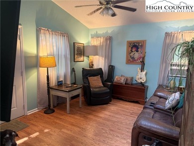 Welcome to 61 River Loop, a charming mountain retreat nestled on Land Harbor Golf Course in North Carolina - for sale on GolfHomes.com, golf home, golf lot