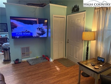 Welcome to 61 River Loop, a charming mountain retreat nestled on Land Harbor Golf Course in North Carolina - for sale on GolfHomes.com, golf home, golf lot