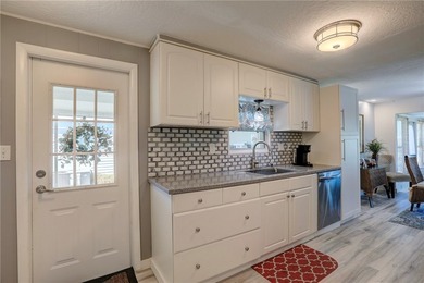 Direct golf course frontage with sweeping views from patio on Barefoot Bay Golf Course in Florida - for sale on GolfHomes.com, golf home, golf lot