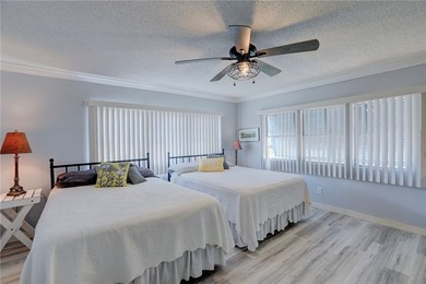 Direct golf course frontage with sweeping views from patio on Barefoot Bay Golf Course in Florida - for sale on GolfHomes.com, golf home, golf lot