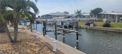 SEIZE this RARE OPPORTUNITY TO OWN A CORNER CANAL WATERFRONT on Pelicans Nest Golf Club in Florida - for sale on GolfHomes.com, golf home, golf lot