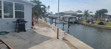 SEIZE this RARE OPPORTUNITY TO OWN A CORNER CANAL WATERFRONT on Pelicans Nest Golf Club in Florida - for sale on GolfHomes.com, golf home, golf lot