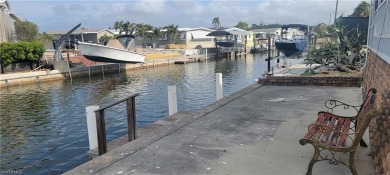 SEIZE this RARE OPPORTUNITY TO OWN A CORNER CANAL WATERFRONT on Pelicans Nest Golf Club in Florida - for sale on GolfHomes.com, golf home, golf lot