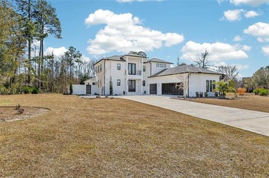 Experience luxury living in this meticulously maintained and on Oak Grove Island Golf and Country Club in Georgia - for sale on GolfHomes.com, golf home, golf lot