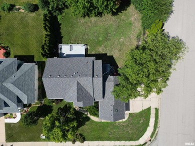 Located on a spacious corner lot just steps from the driving on WeaverRidge Golf Club in Illinois - for sale on GolfHomes.com, golf home, golf lot