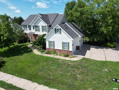 Located on a spacious corner lot just steps from the driving on WeaverRidge Golf Club in Illinois - for sale on GolfHomes.com, golf home, golf lot