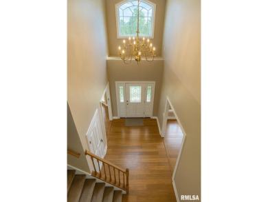 Located on a spacious corner lot just steps from the driving on WeaverRidge Golf Club in Illinois - for sale on GolfHomes.com, golf home, golf lot