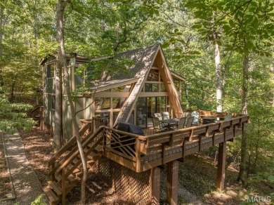 Escape to your own lakeside paradise at this super cute chalet on Innsbrook Resort Golf Course in Missouri - for sale on GolfHomes.com, golf home, golf lot