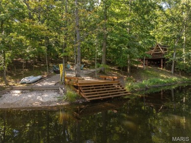 Escape to your own lakeside paradise at this super cute chalet on Innsbrook Resort Golf Course in Missouri - for sale on GolfHomes.com, golf home, golf lot