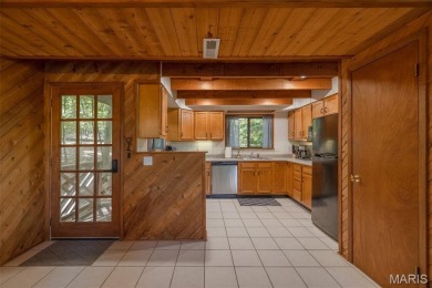 Escape to your own lakeside paradise at this super cute chalet on Innsbrook Resort Golf Course in Missouri - for sale on GolfHomes.com, golf home, golf lot