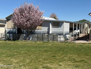 Lot's of living space in this 900 sf home located on the on Juniper Ridge R.V. Golf Resort in Arizona - for sale on GolfHomes.com, golf home, golf lot
