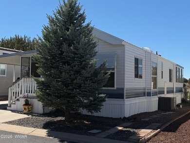 Lot's of living space in this 900 sf home located on the on Juniper Ridge R.V. Golf Resort in Arizona - for sale on GolfHomes.com, golf home, golf lot
