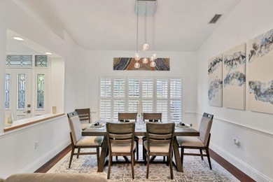 Walk through the front gate and courtyard to discover refined on The Meadows Golf and Country Club in Florida - for sale on GolfHomes.com, golf home, golf lot