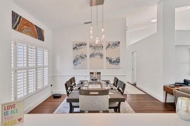 Walk through the front gate and courtyard to discover refined on The Meadows Golf and Country Club in Florida - for sale on GolfHomes.com, golf home, golf lot