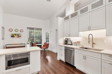 Walk through the front gate and courtyard to discover refined on The Meadows Golf and Country Club in Florida - for sale on GolfHomes.com, golf home, golf lot