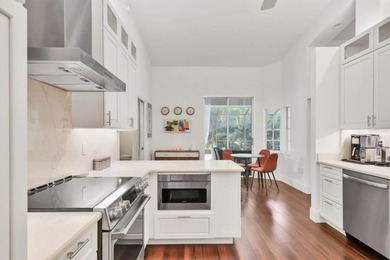 Walk through the front gate and courtyard to discover refined on The Meadows Golf and Country Club in Florida - for sale on GolfHomes.com, golf home, golf lot